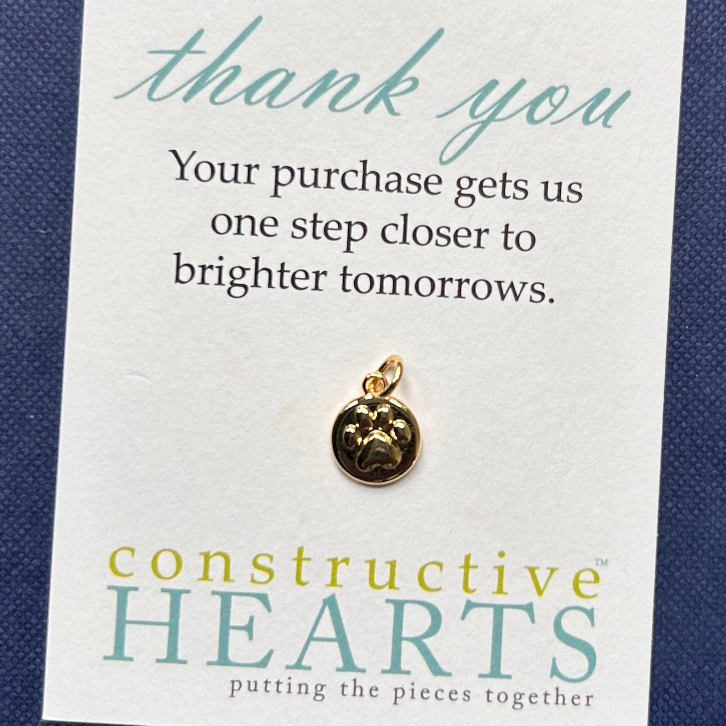 v Paw embossed circle